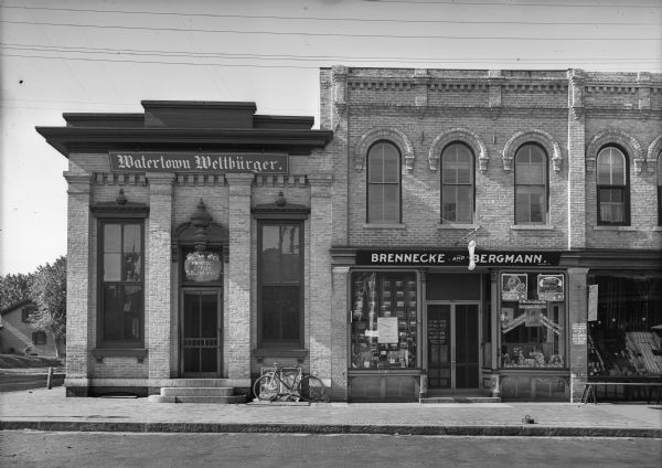 View from street of Brennecke and Bergmann storefront and Watertown Weltbürger Printing Office.