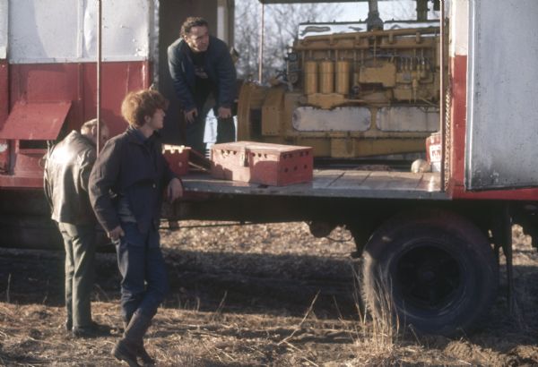 James Bowen, a York landowner in the foreground, and two other men set up a large Caterpillar generator to operate the sound system for Sound Storm. The generator was rented by Golden Freak Enterprises from Bonk's Amusement for $2000.00 for the weekend.