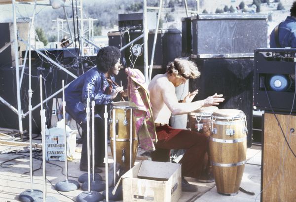 Two unidentified drummers perform with an unidentified band at the Sound Storm music festival.