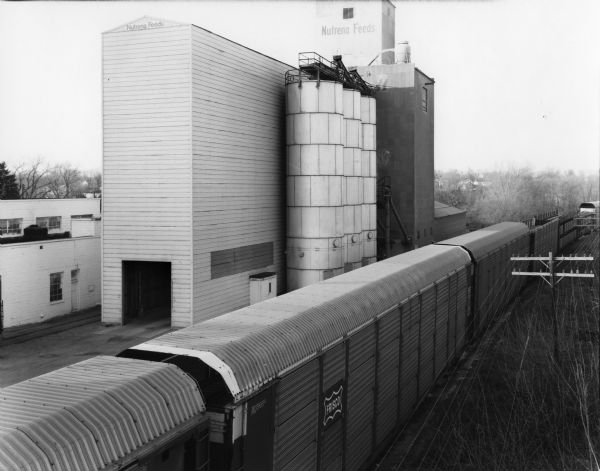 Elevated view over a freight train of the Nutrena Feeds factory.