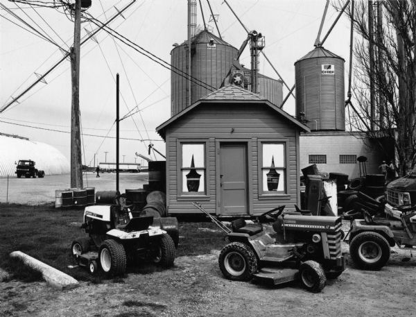 View from behind Don's Gas Station, with tractors displayed on front, on Columbus Street.
