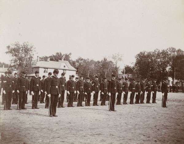 A formation of soldiers stand at attention during the dedication ceremony for the University of Wisconsin-Madison gymnasium.