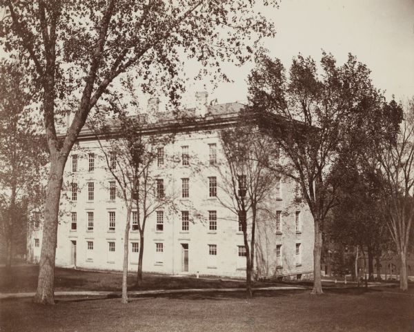 Exterior view of North Hall on the University of Wisconsin-Madison campus. The building is on Bascom Hill and is surrounded by trees.