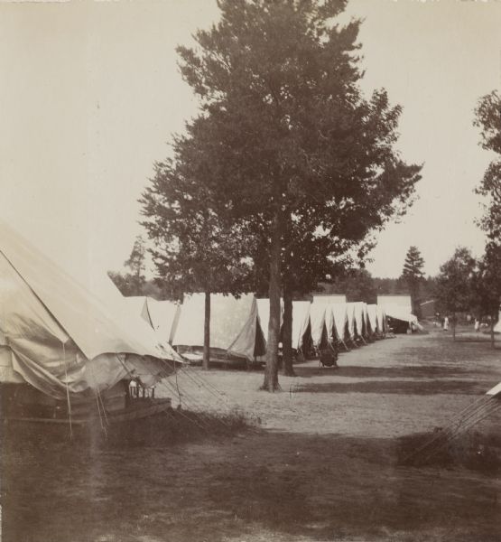 A line of pitched tents at a Fort Douglas encampment. The encampment is occupied by Company A, 3rd Regiment.