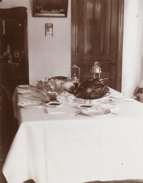 Interior view of the Henry Schildhauer home, located on West Washington Avenue. A table is set for a poultry dinner.