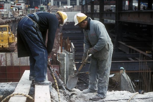 Two construction workers with hard hats at the World Trade Center.