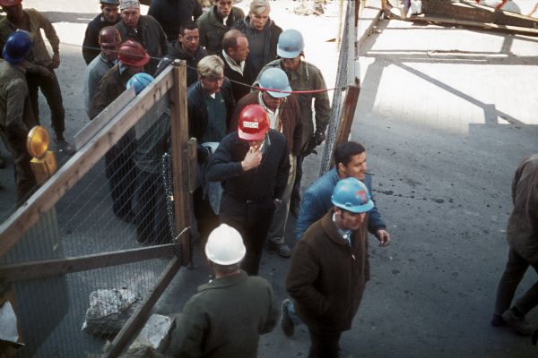 Workers entering the construction area for the World Trade Center at the start of the work day.