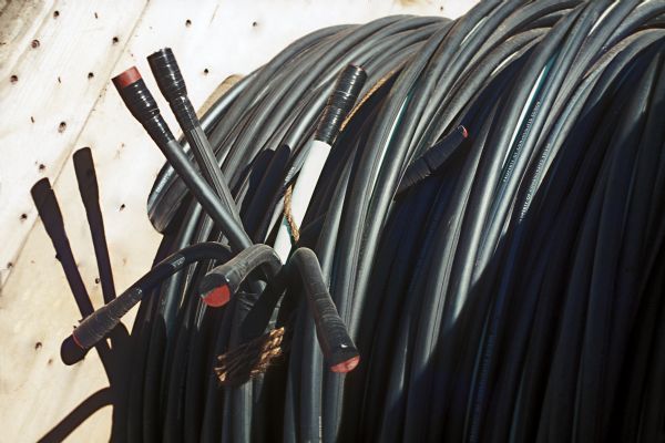 A large coil of black electrical wire.
