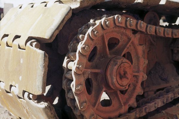 Close-up view of a track on a piece of construction equipment.