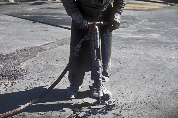 Close-up view of jackhammer operator during the construction of the World Trade Center.
