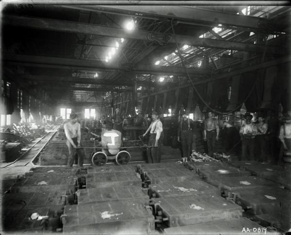 Factory workers pouring hot metal into molds, most likely at the McCormick Reaper Works in Chicago.