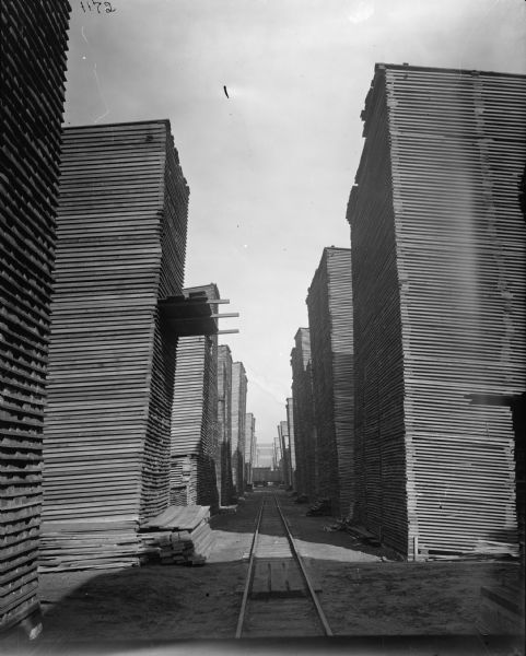 Large stacks of lumber, probably at the McCormick Reaper Works.