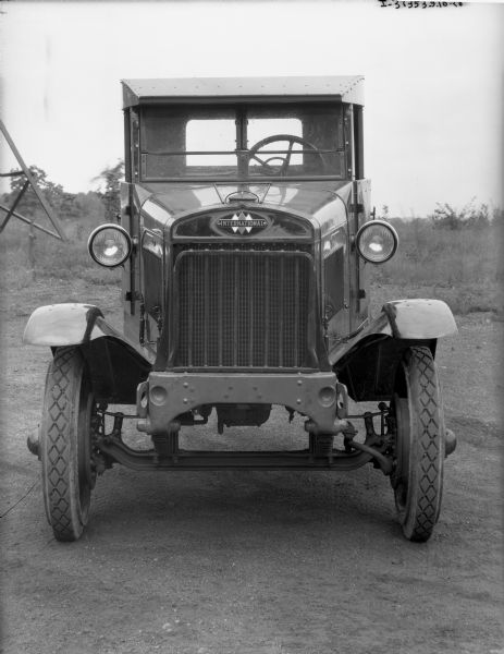 Front view of an International truck parked outdoors. The "International" emblem is above the grill.
