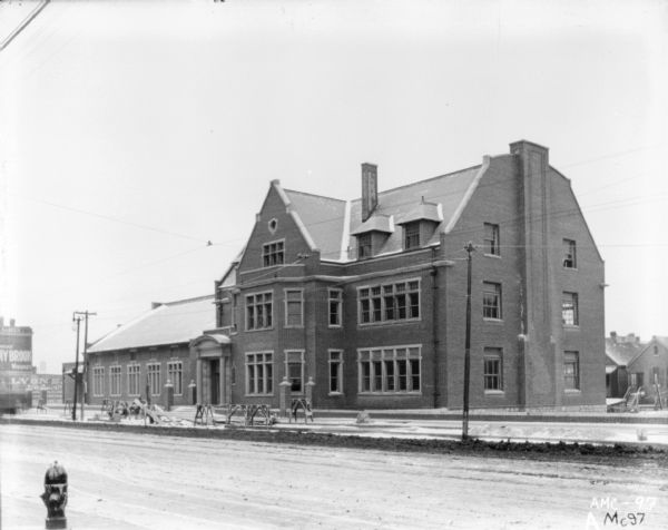 Exterior view across street in winter of the McCormick Works Club House.