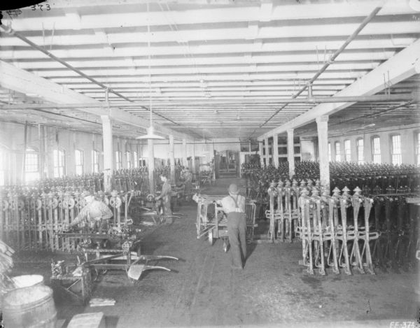 Elevated view of men working in the paint room at McCormick Works.