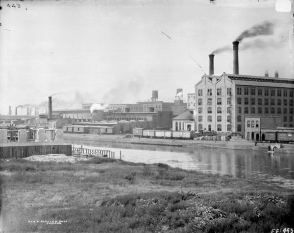 Elevated view from shoreline over canal towards McCormick Works.