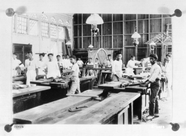 Group of boys working in a workshop.