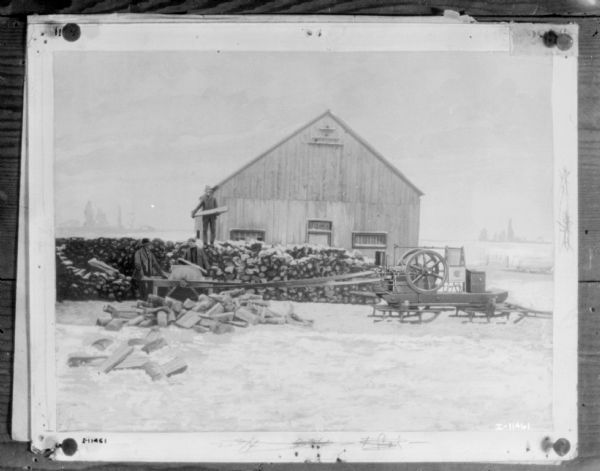View of an engine mounted on a sled providing belt-driven power to a wood saw. Three men are standing near the saw in front of a large stack of wood. A barn is in the background.