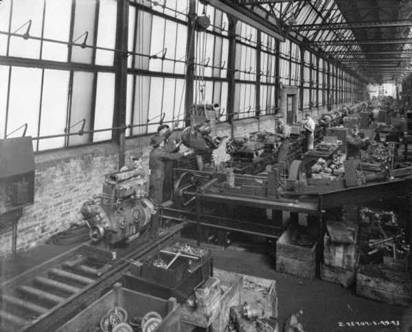 Elevated view of men working in the manufacturing area of a factory.