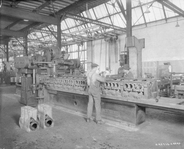 Men working in a manufacturing area of a factory.