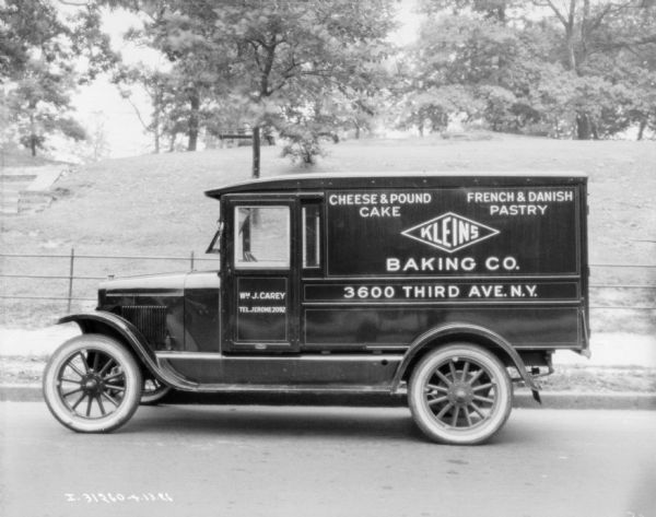 Left side profile view of a Klein's Baking Co. delivery truck parked outdoors.