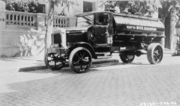 Oil delivery truck in Europe. Painted on the tank is a sign that reads: "West India Oil Company, Nafta Wico Equilibrada."