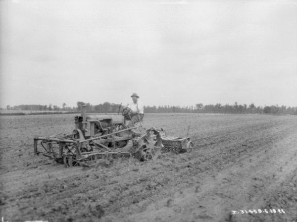 Man Using Farmall Tractor in Field | Photograph | Wisconsin Historical ...