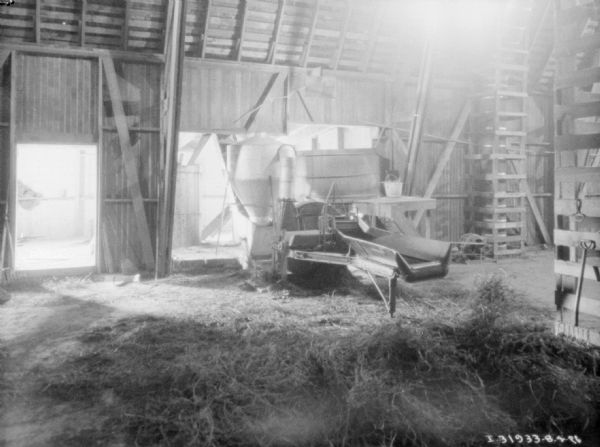 View of a grain mill in a barn.