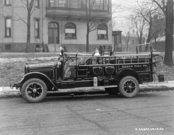 Fire truck parked along a curb. The sign painted on the side reads: "Bower HIll Vol. Fire Dept."