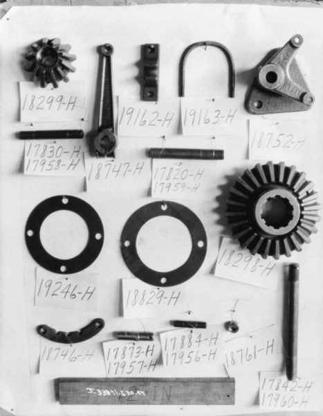 Labeled machine parts displayed on a wall.