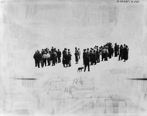 View of a group of people who are facing away looking at something. 