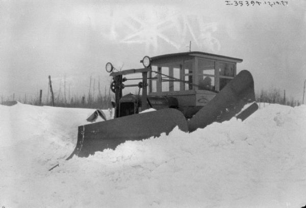 View from front of a snowplow working in deep snow.