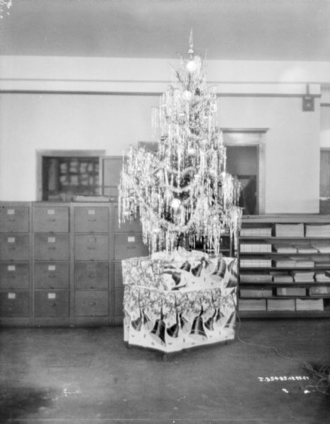 A decorated Christmas tree in an office.
