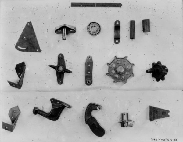 Machine parts displayed on a board.