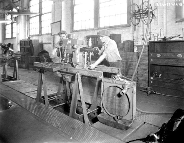 Two Men Assembling Parts for Farmall Tractor | Photograph | Wisconsin ...