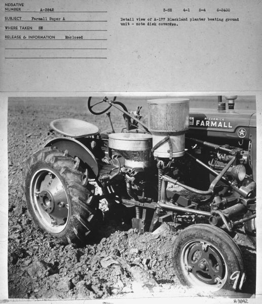 Right side view of a Farmall Super A tractor.
Subject: "Farmall Super A." Where Taken: "SE." Information with photograph reads: "Detail view of A-177 Blackland planter beating ground unit — note disk covers."