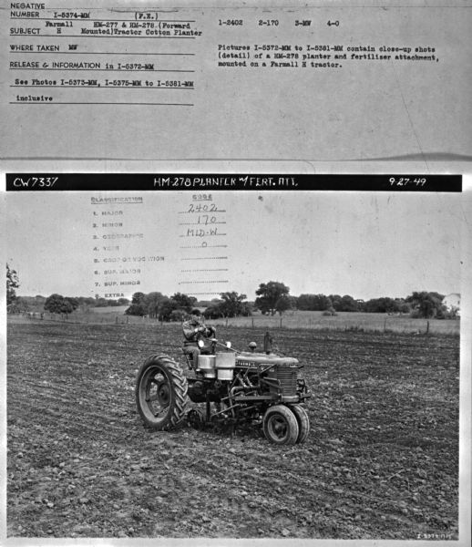 Three-quarter view from front right of a man driving a Farmall H in a field. Subject: "Farmall H. HM-277 & HM-278 (Forward Mounted) Tractor Cotton Planter." Where Taken: "MW." Information with photograph reads: "Pictures I-5372-MM to I-5381-MM contain close-up shots (detail) of a HM-278 planter and fertizlizer attachment, mounted on a Farmall H tractor."