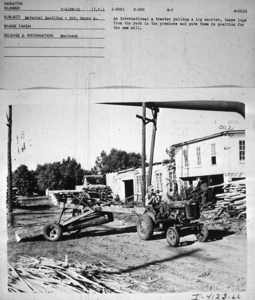 A man is driving an International A tractor. Subject: "Material Handling — Int. Super A." Information with photograph reads: "An International A tractor pulling a log carrier, takes logs from the yard in the premises and puts them in position for the saw mill."