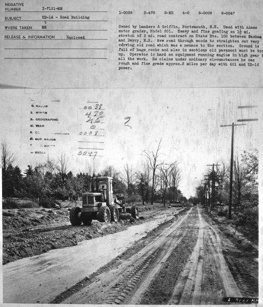 Subject: "UD-16 — Road Building." Where Taken: "NE." Information with photograph reads: "Owned by Landers & Griffin, Portsmouth, N.H. Used with Adams motor grader, Model 601. Heavy and fine grading on 1 1/2 mi. stretch of 3 mi. road contract on State Rte. 102 between Nashua & Derry, N.H. New road through woods to straighten out very curving old road which was a menace to the section. Ground is full of huge rocks and also in sections old pavement must be torn up. Operator is hard on equipment running engine in high gear in all the work. He claims under ordinary circumstances he can rough and fine grad approx. 2 miles per day with 601 and UD-16 power."