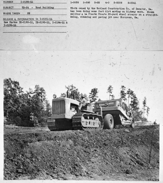 Three-quarter view from front right of a man driving a TD-24. Subject: "TD-24 — Road Building." Where Taken: "SE." Information with photograph reads: "TD-24 owned by the Rutland Construction Co. of Decatur, Ga. has been doing some fast dirt moving on highway work. Shown pulling a La Plante Choate 20-yard wheel scraper on a straightening, widening and paving job near Norcross, Ga."