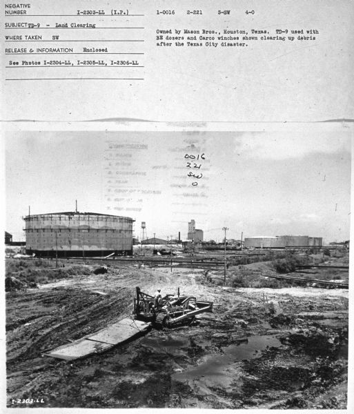 Elevated view of man driving TD-9. Subject: "TD-9 — Road Building." Where Taken: "SW." Information with photograph reads: "Owned by Mason Brod., Houston, Texas. TD-9 used with BE dozers and Carco winches shown clearing up debris after the Texas City disaster."