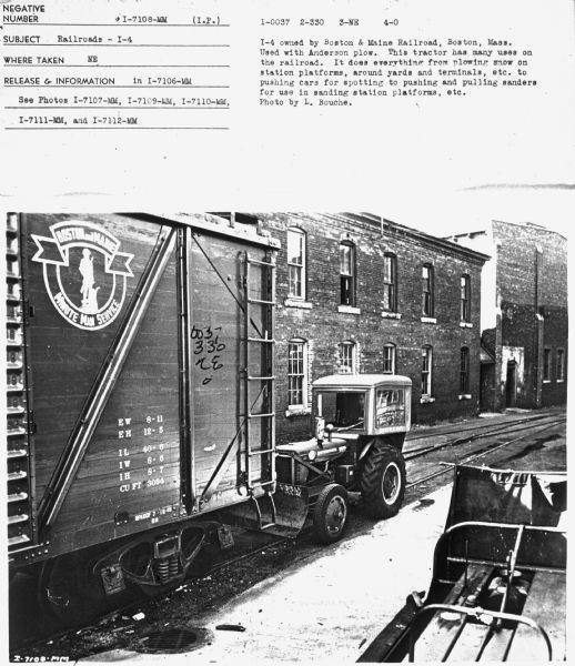 Subject: "Railroads — I-4." Where Taken: "NE." Information with photograph reads: "I-4 owned by Boston & Maine Railroad, Boston, Mass. Used with Anderson plow. This tractor has many uses on the railroad. It does everything from plowing snow on station platforms, around yards and terminals, etc. to pushing cars for spotting to pushing and pulling sanders for use in sanding station platforms, etc. Photo by L. Bouche." 	