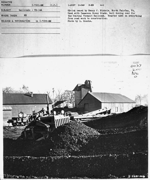Subject: "Railroads — TD-14A." Where Taken: "NE." Information with photograph reads: "TD-14A owned by Henry J. Nichols, North Fairfax, Vt. Used with Isaacson Dozer Blade, bull dozing coal for the Central Vermont Railroad. Tractor used on everything from road work to construction. Photo by L. Bouche."