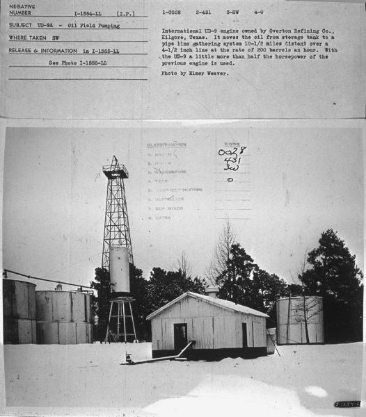 Subject: "UD-9A — Oil Field Pumping." Where Taken: "SW." Information with photograph reads: "International UD-9 engine owned by Overton Refining Co., Kilgore, Texas. It moves oil from storage tank to a pipe line gathering system 10-1/2 miles distant over a 4-1/2 in. line at the rate of 200 barrels an hour. With the UD-9 a little more than half the horsepower of the previous engine is used. Photo by Elmer Weaver."