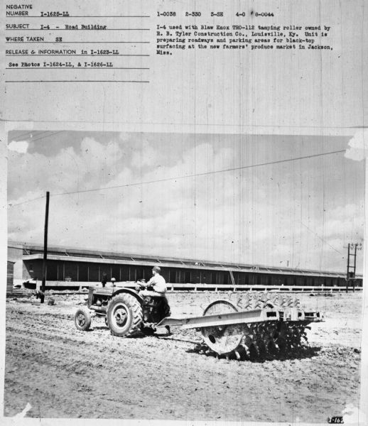 Subject: "I-4 — Road Building." Where Taken: "SE." Information with photograph reads: "I-4 used with Blaw Knox TRO-112 Tamping roller owned by R.B. Tyler Construction Co., Louisville, Ky. Unit is preparing roadways and parking areas for black-top surfacing at the new farmers' produce market in Jackson, Miss."