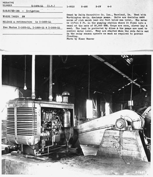 Subject: "UD-18A — Irrigation." Where Taken: "SW." Information with photograph reads: "Owned by Delta Securities Co., Inc., Raceland, La. Used with Worthington 48-inch drainage pumps. Units are draining 4,400 acres of rich marsh land six feet below sea level. The water is lifted 8 ft. in the pumping station where it flows into a canal at the rate of 50,000 GPM. Crops are corn, clover hay and seed. The land is protected by dikes & the pumps are used to control water level. They are started when the rain falls & in the rainy season operate as much as required to prevent flooding. Photo by Elmer Weaver."	