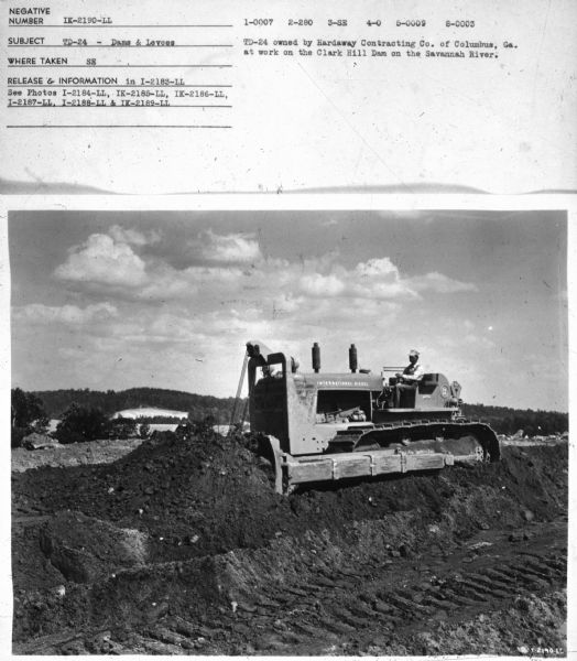 Subject: "TD-24 — Dams & Levees." Where Taken: "SE." Information with photograph reads: "TD-24 owned by Hardaway Co. of Columbus, Ga. at work on the Clark Hill Dam on the Savannah River."