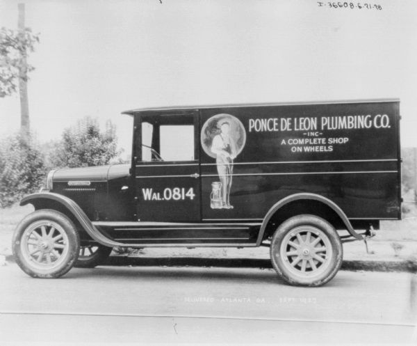 Driver's side view of a delivery trucked parked along a curb. The sign on the truck reads: "Ponce De Leon Plumbing."
