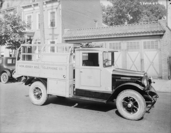 View towards the passenger side of a delivery truck. The sign painted on the side of the truck reads: "New Jersey Bell Telephone Co."