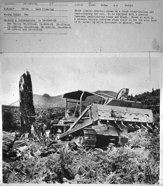 View towards man using a TD-24 to pull a stump. Mountains are in the background. Subject: "TD-24 — Lumbering." Where Taken: "Pac." Information with photograph reads: "TD-24 crawler tractor, shown on a tough stump-pulling and land clearing purposes in a try-out in these photographs. This is a 15-acre thickly infested stump field on the 160-acre farm of G. Loden, 2 1/2 miles northeast of Mineral, Calif."